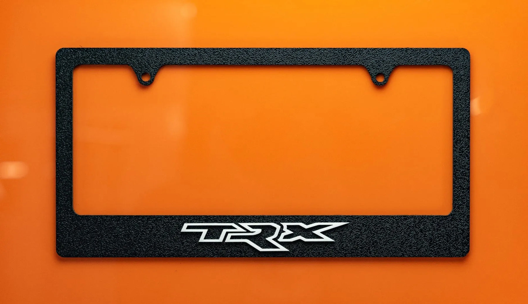 Borde para matrícula TRX®: producto con licencia oficial
