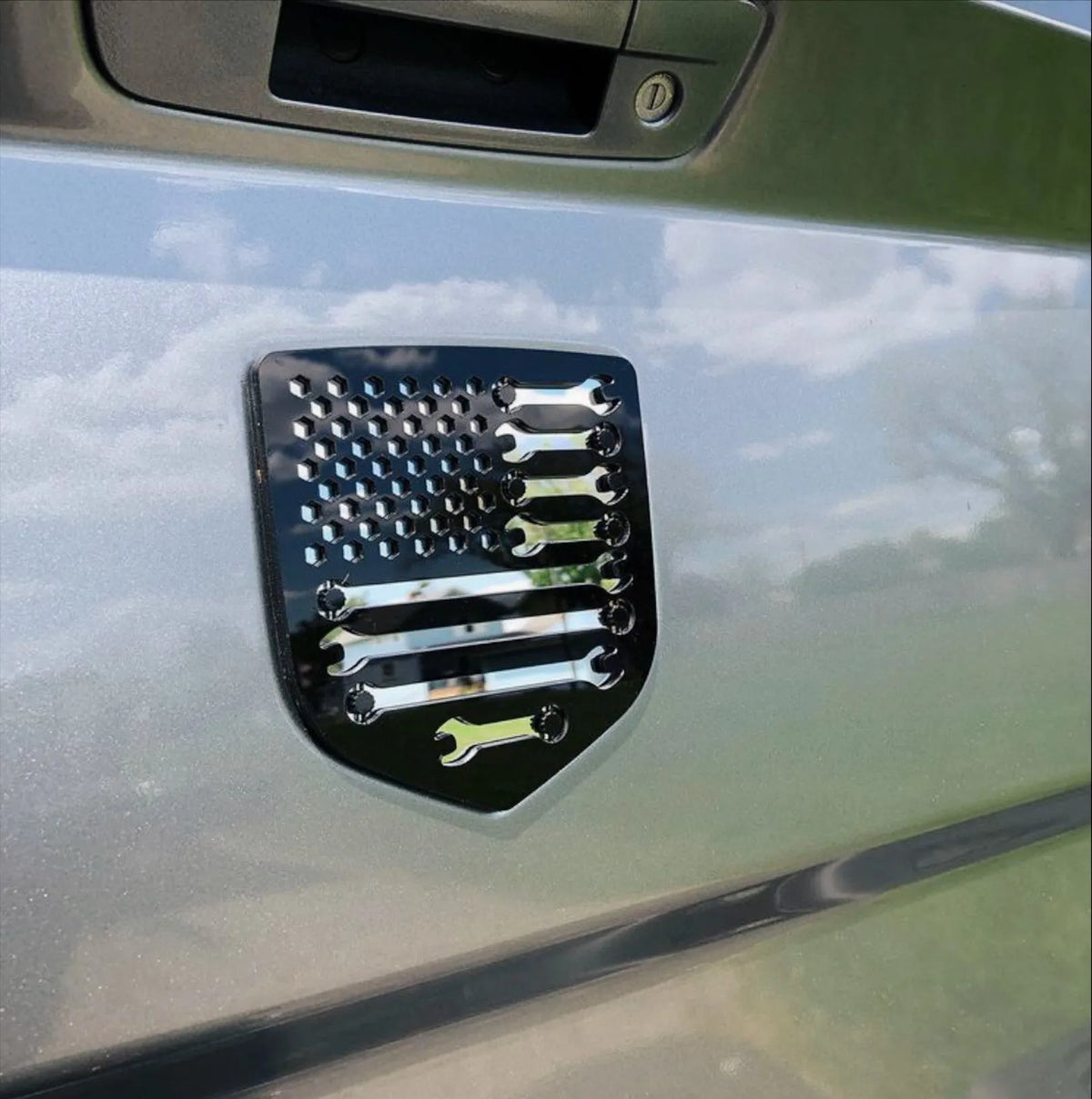 Mechanics American Flag Badge - Fits 2008-2018 Dodge® Ram® Tailgate -1500, 2500, 3500 - Black on Mirror