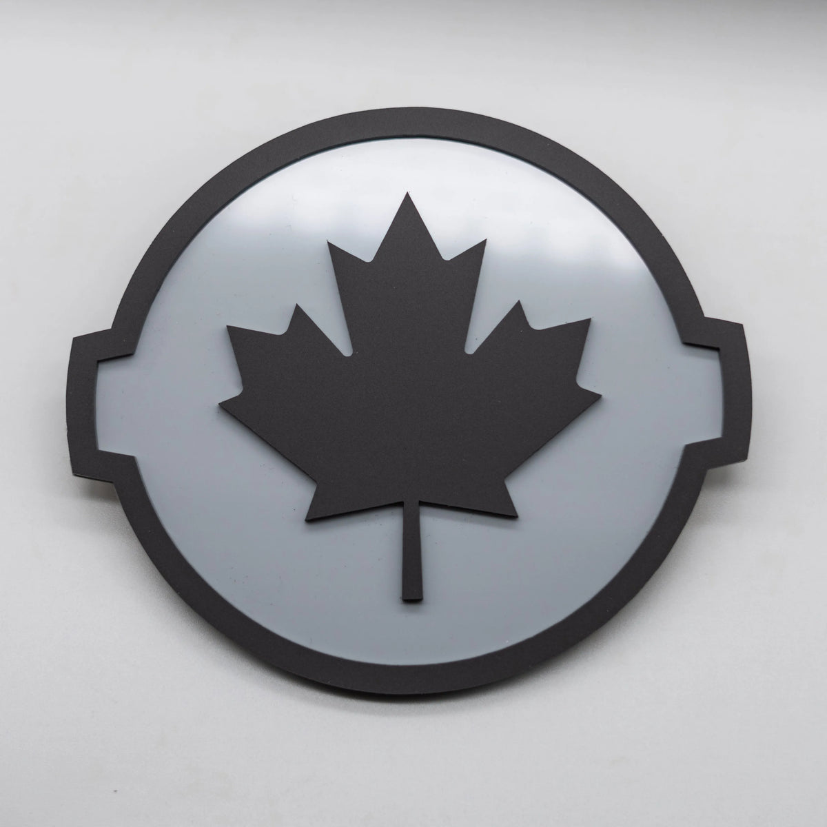 CANADIAN BADGE - FITS 2016-2024 NISSAN® TITAN® TAILGATE - BLACK ON GREY